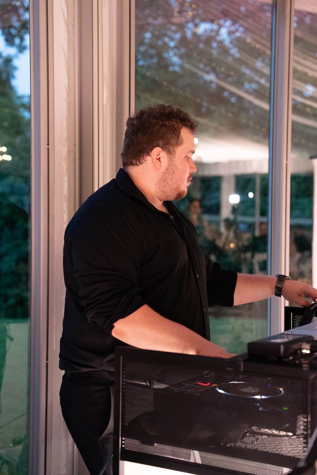 DJ working the booth as the reception continues